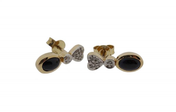 14 karaat gouden oorstekers met diamanten en zwarte onyx